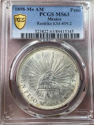 万国钱币拍卖第053期（万国秋季大拍●上） - PCGS MS63 1898MO AM墨西哥直边鹰洋比索 银霜转光