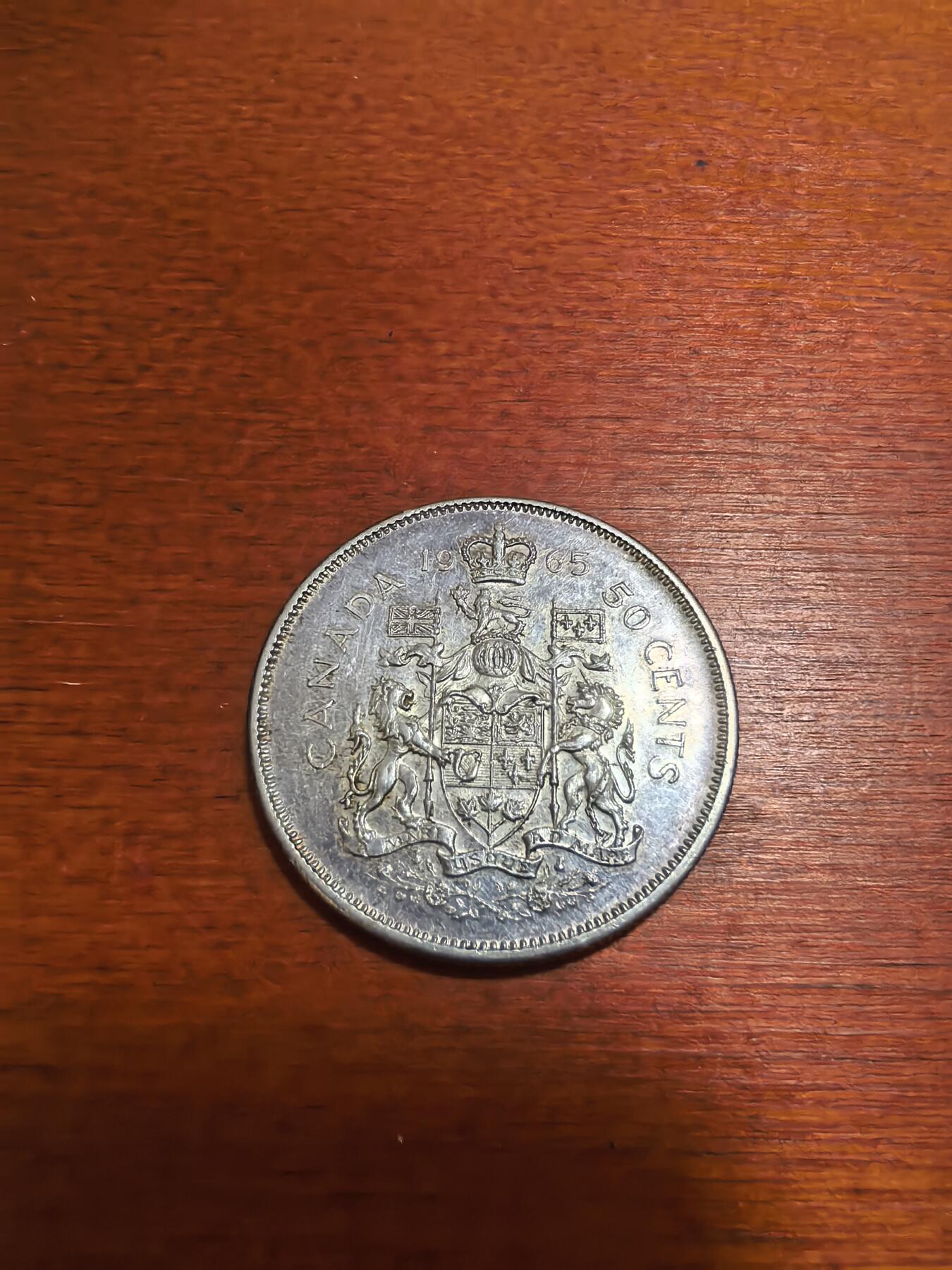 长老汇蛇年精选第六十五场拍卖 1965加拿大国徽50分银币，11.66克800银