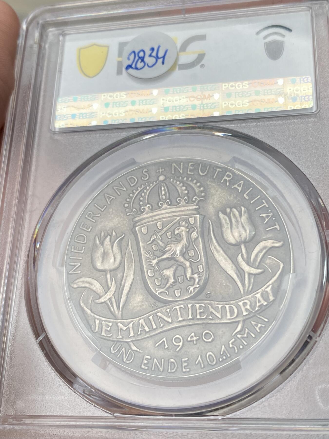 万国钱币拍卖第053期【万国秋季大拍下●周五周六两场连拍】 PCGS SP63 1940年德国民族社会主义工人党占领荷兰纪念银章 卡尔哥茨大师技艺 尼德兰风车变为万字 郁金香的凋零 三帝国珍稀品种之一 无论品种还是品相皆属顶级 麦稀奇首拍 PC唯一亚军 更高分仅一枚（原图请私信后台或自行查询官网）