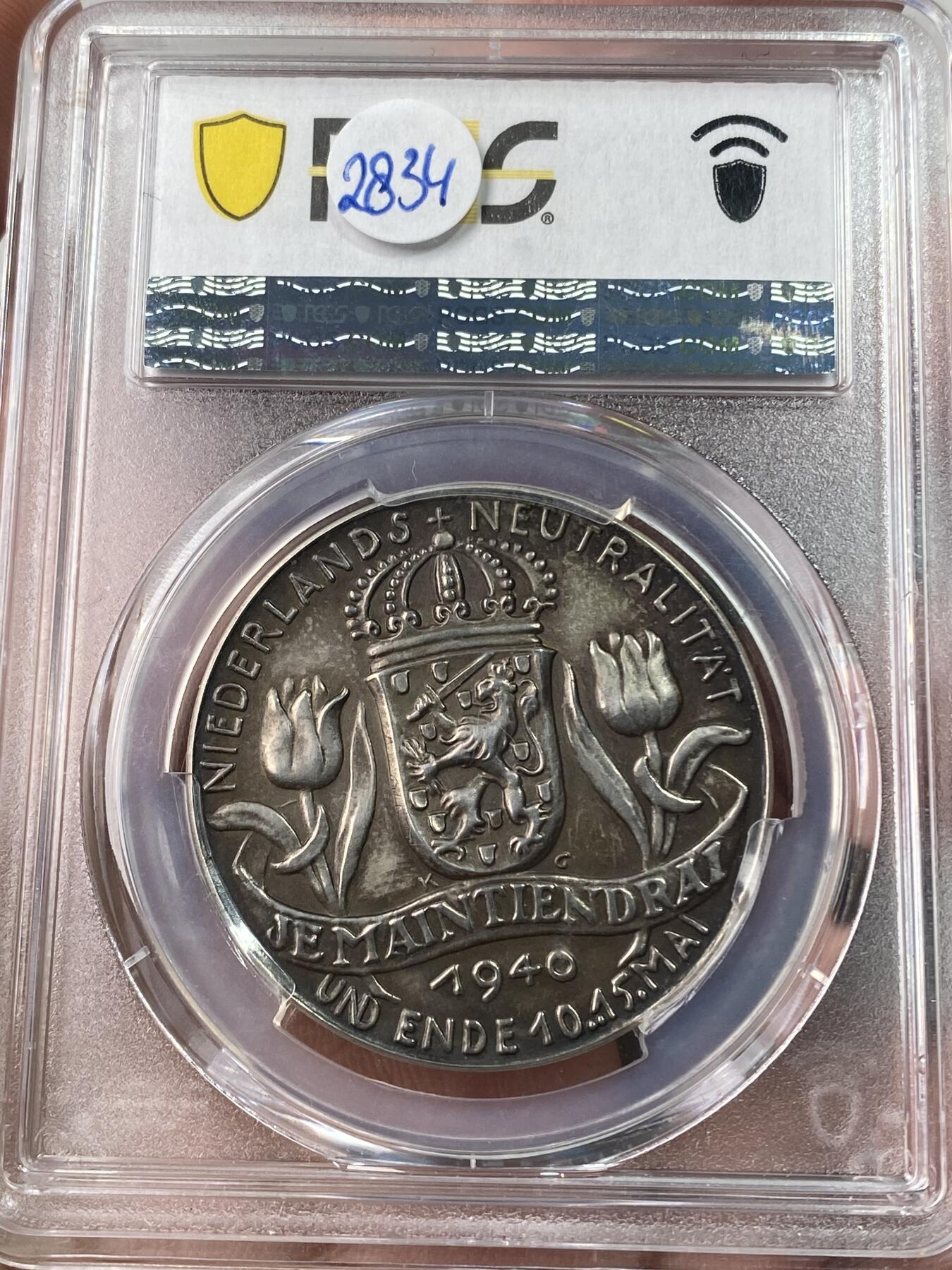 万国钱币拍卖第053期【万国秋季大拍下●周五周六两场连拍】 PCGS SP63 1940年德国民族社会主义工人党占领荷兰纪念银章 卡尔哥茨大师技艺 尼德兰风车变为万字 郁金香的凋零 三帝国珍稀品种之一 无论品种还是品相皆属顶级 麦稀奇首拍 PC唯一亚军 更高分仅一枚（原图请私信后台或自行查询官网）