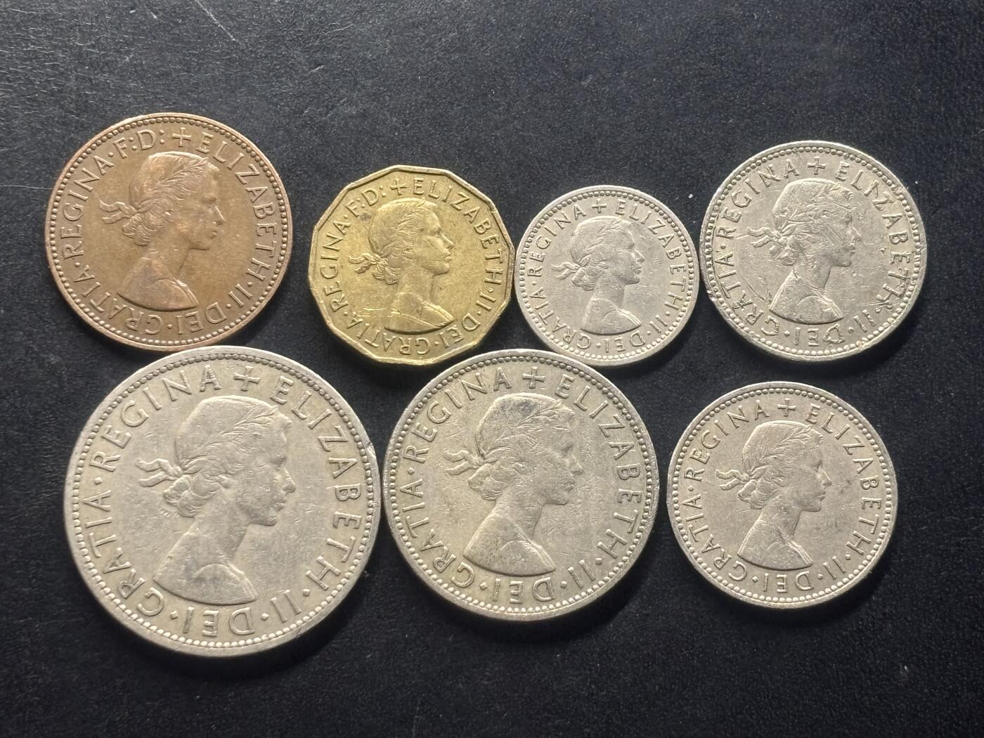 邮泉阁限时拍卖第三十二场 英国硬币专场（硬币在国外。请付邮费6元。） 英国伊丽莎白二世女王1955年7枚