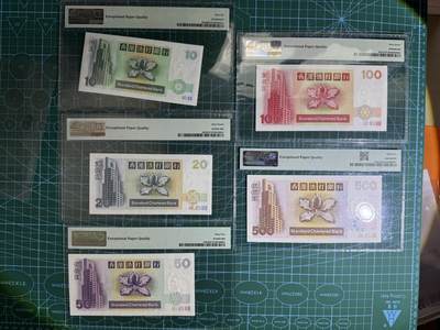 【炜奕收藏】，第四十八期，多套港澳日本纸币 香港渣打银行10-500短棍神兽共五张，PMG65-67分，均为AA或A冠，包含一张无47尾8