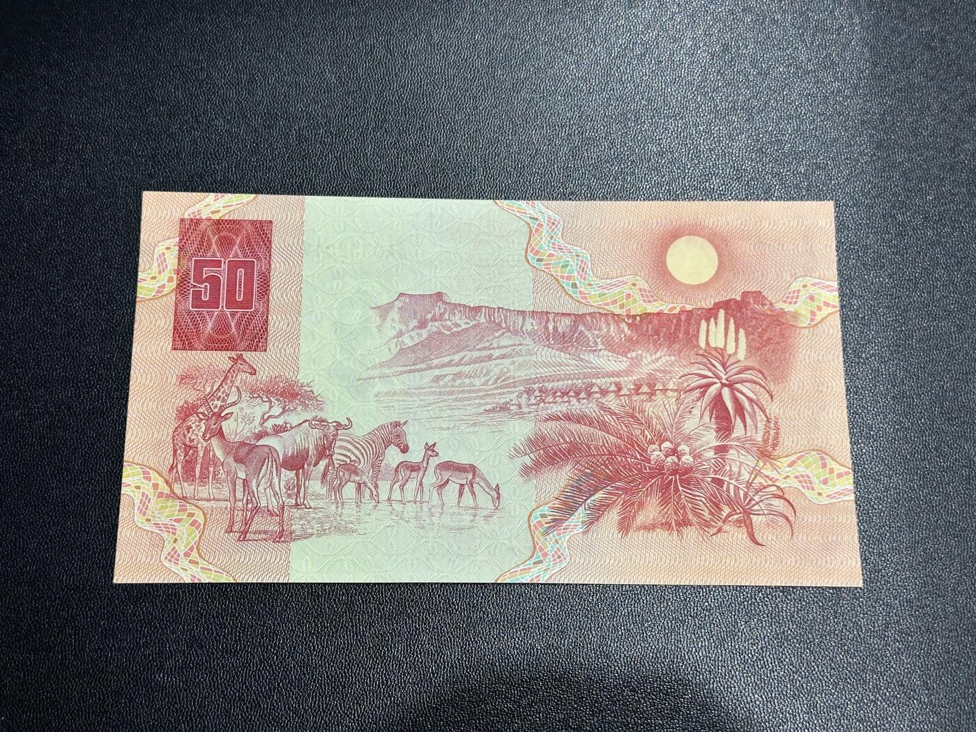 《外钞收藏家》第五百七十八期（热门品种好货场）（本平台长期征集拍品、欢迎藏友们联系合作） 1984年版50兰特 动物大迁徙 首发AA冠 全新不绝 一个角有小瑕疵