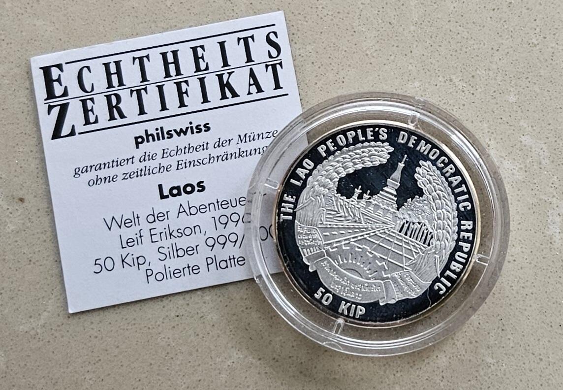 【币将精彩】世界钱币拍卖（2025-11-12） 老挝1996年探险家莱夫埃里克森银币  面值50基普，15克彩色纪念银币带证书。