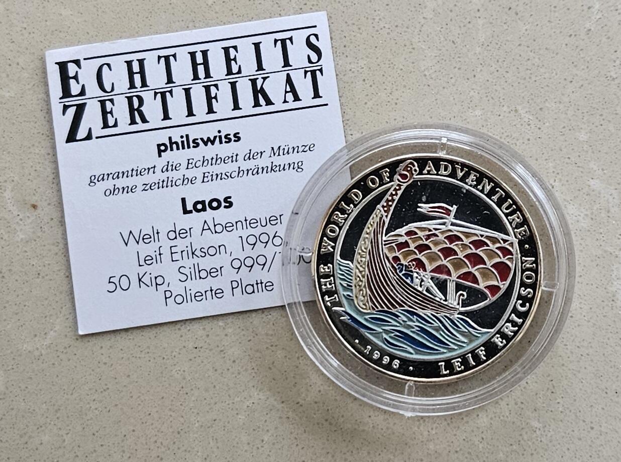 【币将精彩】世界钱币拍卖（2025-11-12） 老挝1996年探险家莱夫埃里克森银币  面值50基普，15克彩色纪念银币带证书。