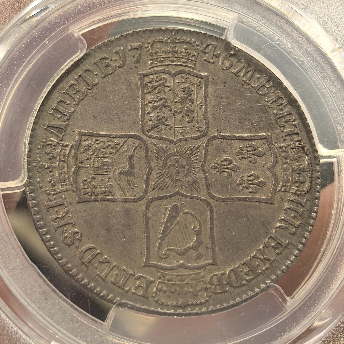 博洋堂世界钱币拍卖第144期（全场包邮） PCGS AU55 英国1746年乔二半克朗银币，整个币面均匀包覆在灰色带彩包浆下，币面光度一流，状态绝对超出同类分数。