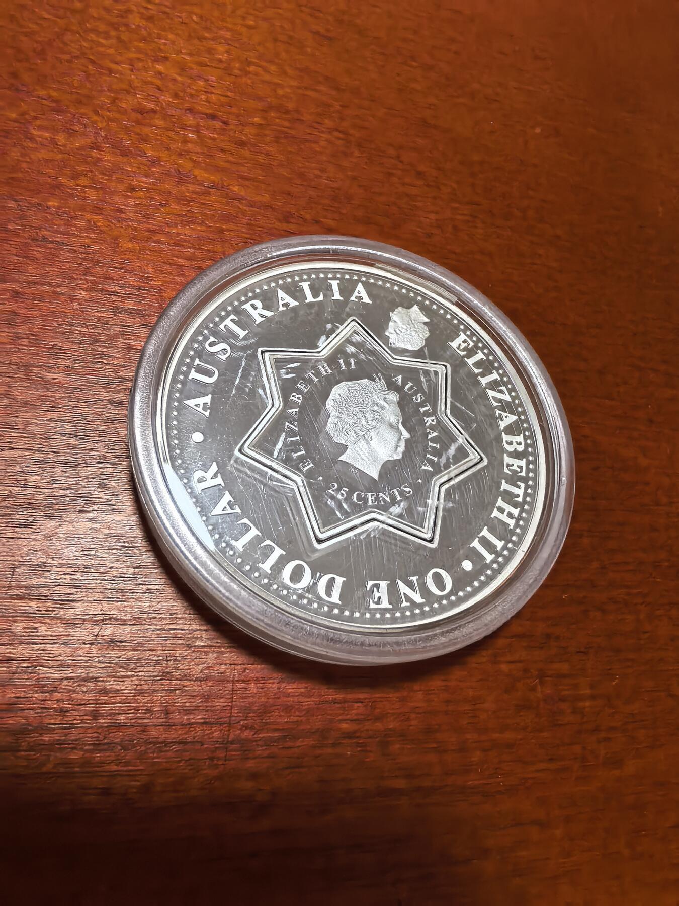 长老汇蛇年精选第六十七场拍卖 2001澳大利亚星状子母币1.25元类精制银币，1盎司999银，盒证全，克书标39克，实称32.19克，21668枚