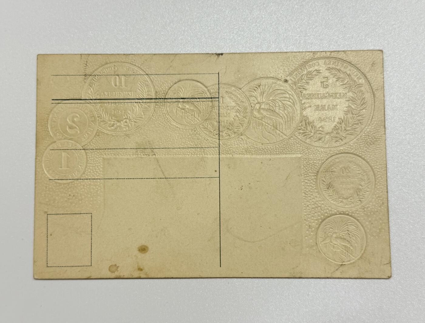 韵星假日精品2025秋季军品类拍卖会-- Rimey Holidays Boutique 2025 Autumn Militaria Sale 帝德高浮雕明信片—德属巴布亚新几内亚货币主题，带有帝国马克与当时主要国家的汇率对照表，设计精美，极为稀少的题材