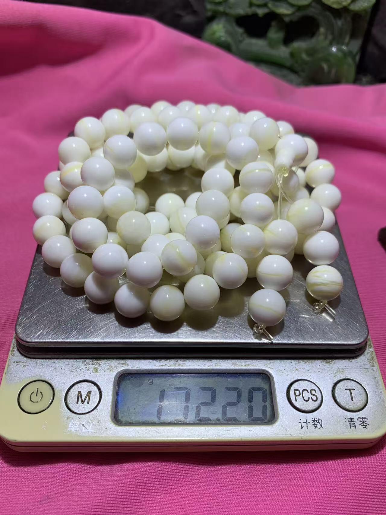 深海奶白飘黄贝金丝化玉108手串一条，