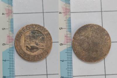 回流铜章硬币 - SAFEND RIN”“25 YEARS”字样