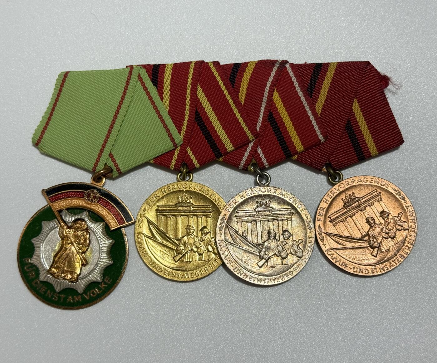 韵星假日精品2025秋季军品类拍卖会-- Rimey Holidays Boutique 2025 Autumn Militaria Sale 民主德国勋章联排、勋略   工战队优秀服役+忠诚服役联排  人民警察荣誉勋章+工战队功绩全套联排  勋略：国家荣誉、民警功勋 各类工战队功勋、服役   镀金帽徽