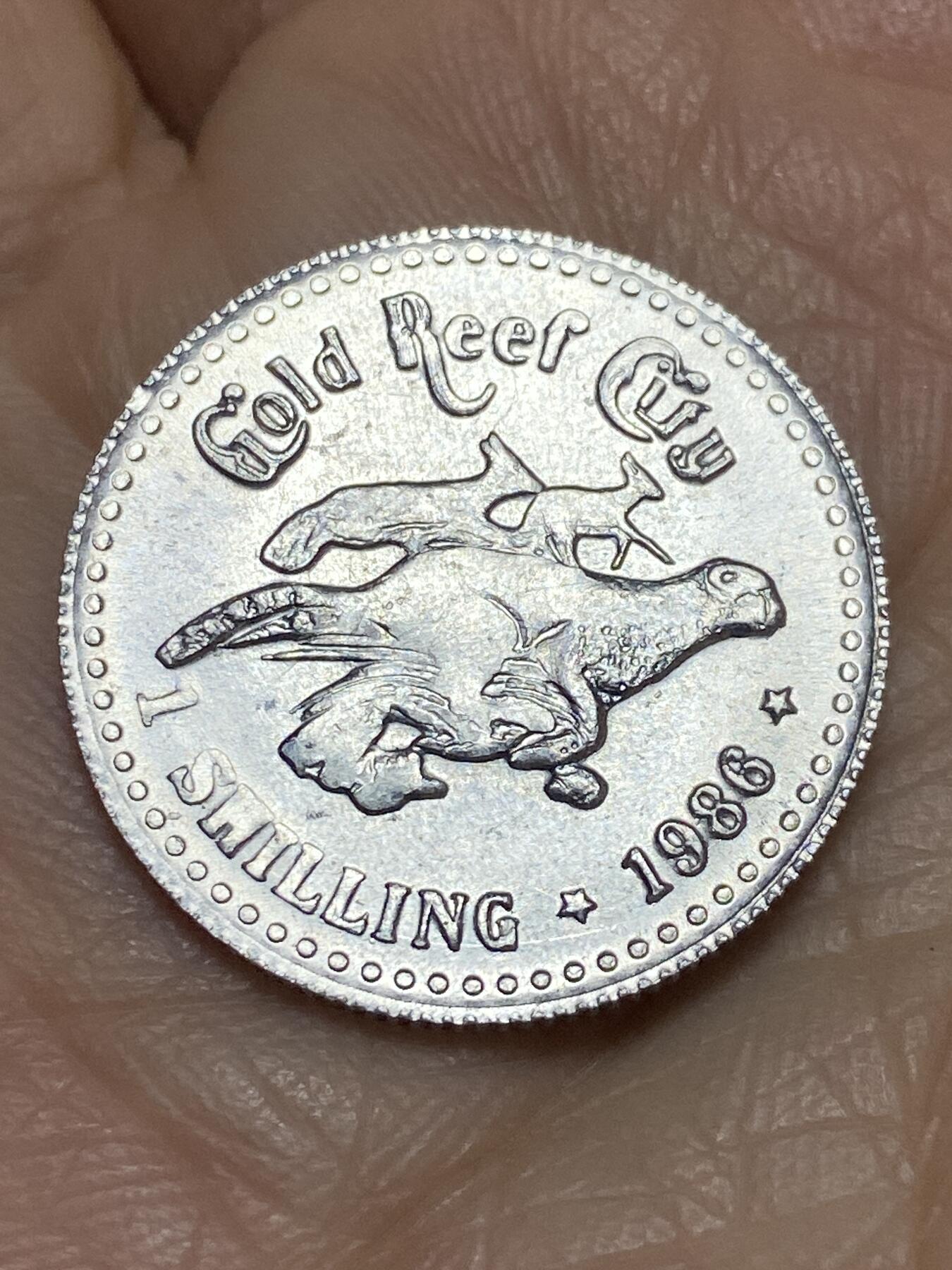 2025年第一百一十九场(总第一百四十五场）外国好品散币(免佣金) 南非🇿🇦1986年1先令(约翰内斯堡金礁城铸币局发型淘金主题公园纪念币)