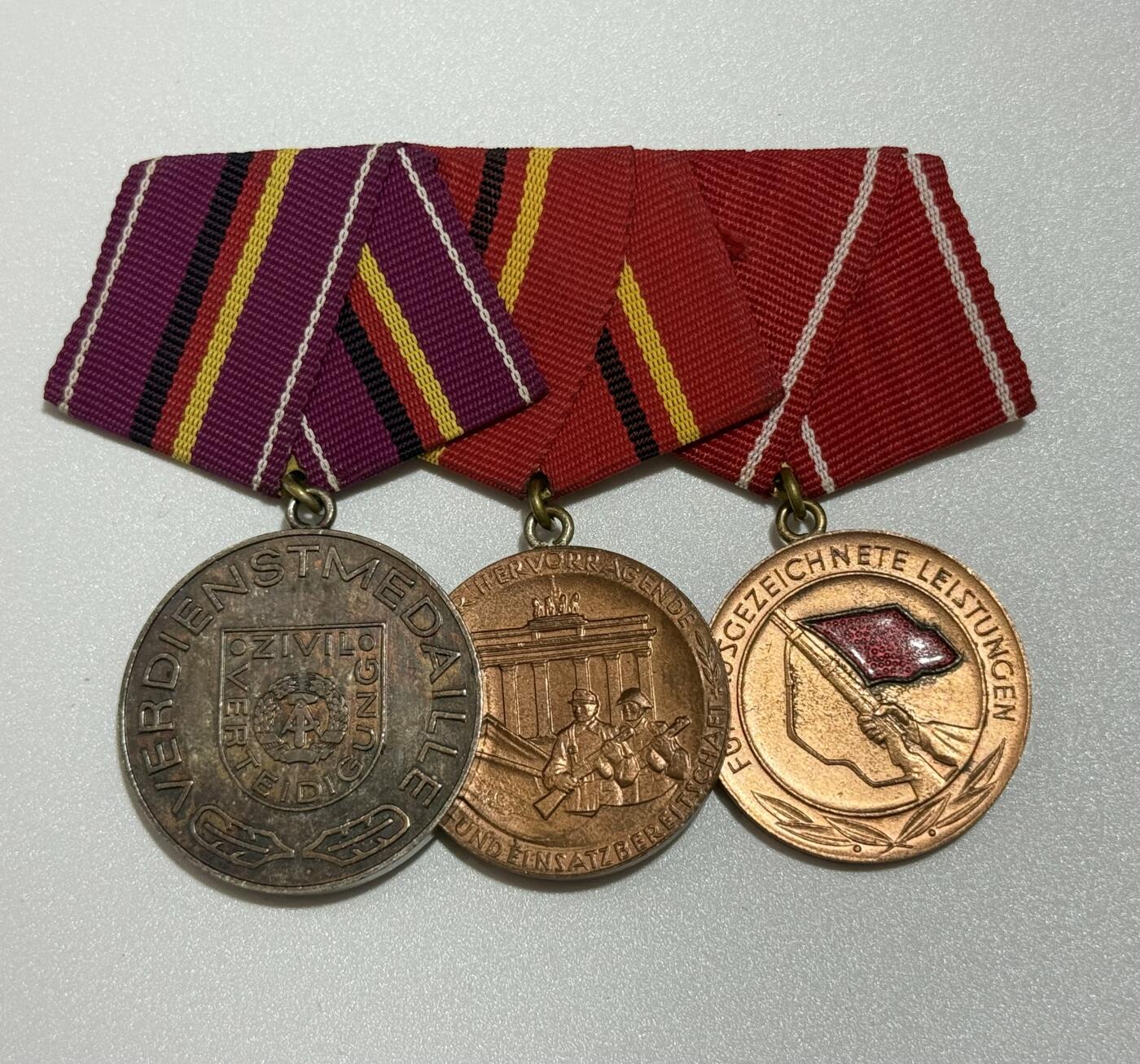 韵星假日精品2025秋季军品类拍卖会-- Rimey Holidays Boutique 2025 Autumn Militaria Sale 民主德国三联排--银级民防功绩奖章、铜级工战队功绩奖章和工战队优异成就奖章