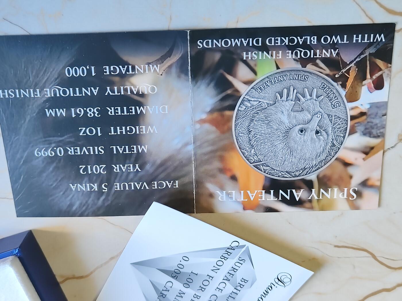 第180期拍卖【长期征集拍品】【北京币展专场】 镶嵌真钻石（有钻石证书）1盎司原厂盒证巴布亚新几内亚2012年多刺食蚁兽仿古银币999银31.1克直径38.61毫米发行量仅1000枚