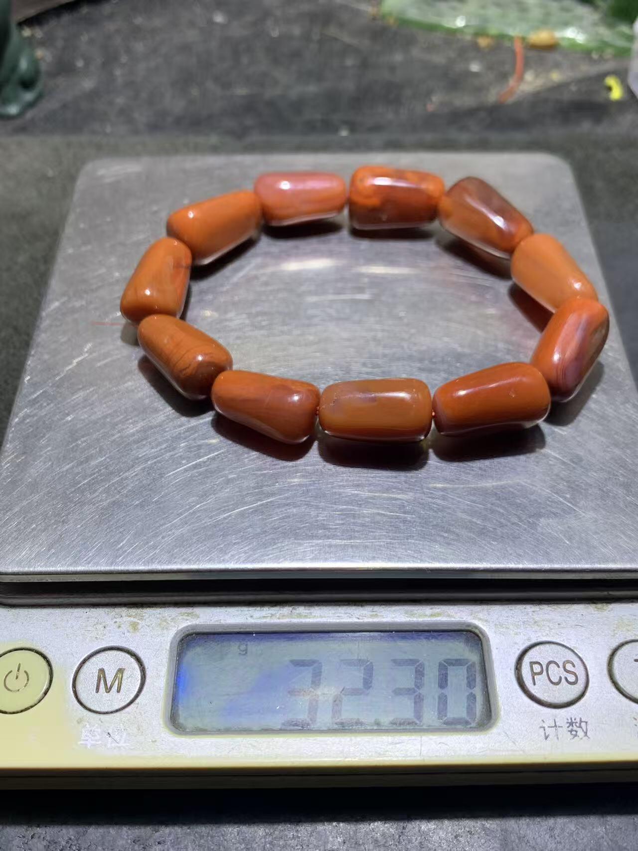 川料柿子红南红玛瑙随形单圈手串一条，