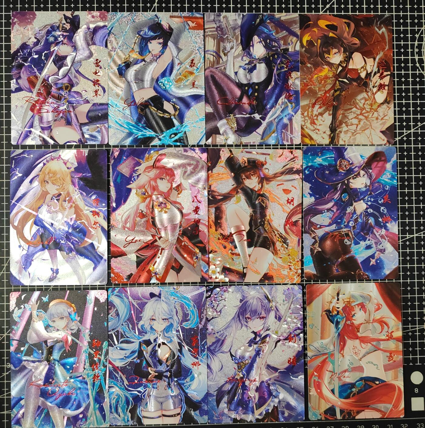 铃鹿第九期（提示一：自制卡难免瑕疵，可能存在撞角爆边等出厂瑕疵，介意慎拍；提示二：参拍请慎重，跑单押金不退的）） 原神年历粗闪烫红套