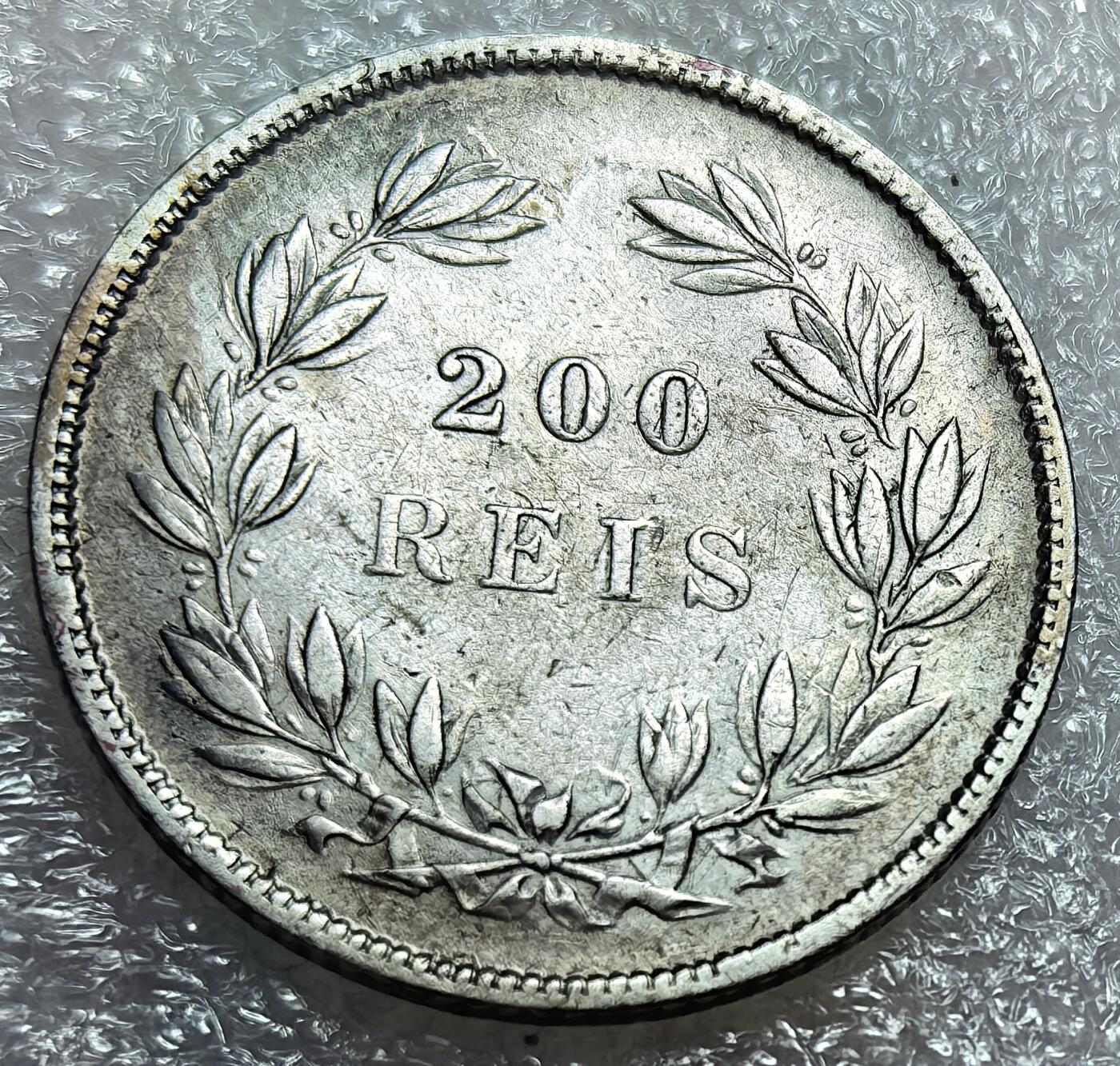 埃及、德属东非、匈牙利、葡萄牙、沙俄古银币古铜币，周五晚上九点倒数截拍，满百包邮，可寄存半年，喜欢朋友微信扫描二维码可直接参拍 好品相少有葡萄牙1855年200瑞斯小国王银币，Km491