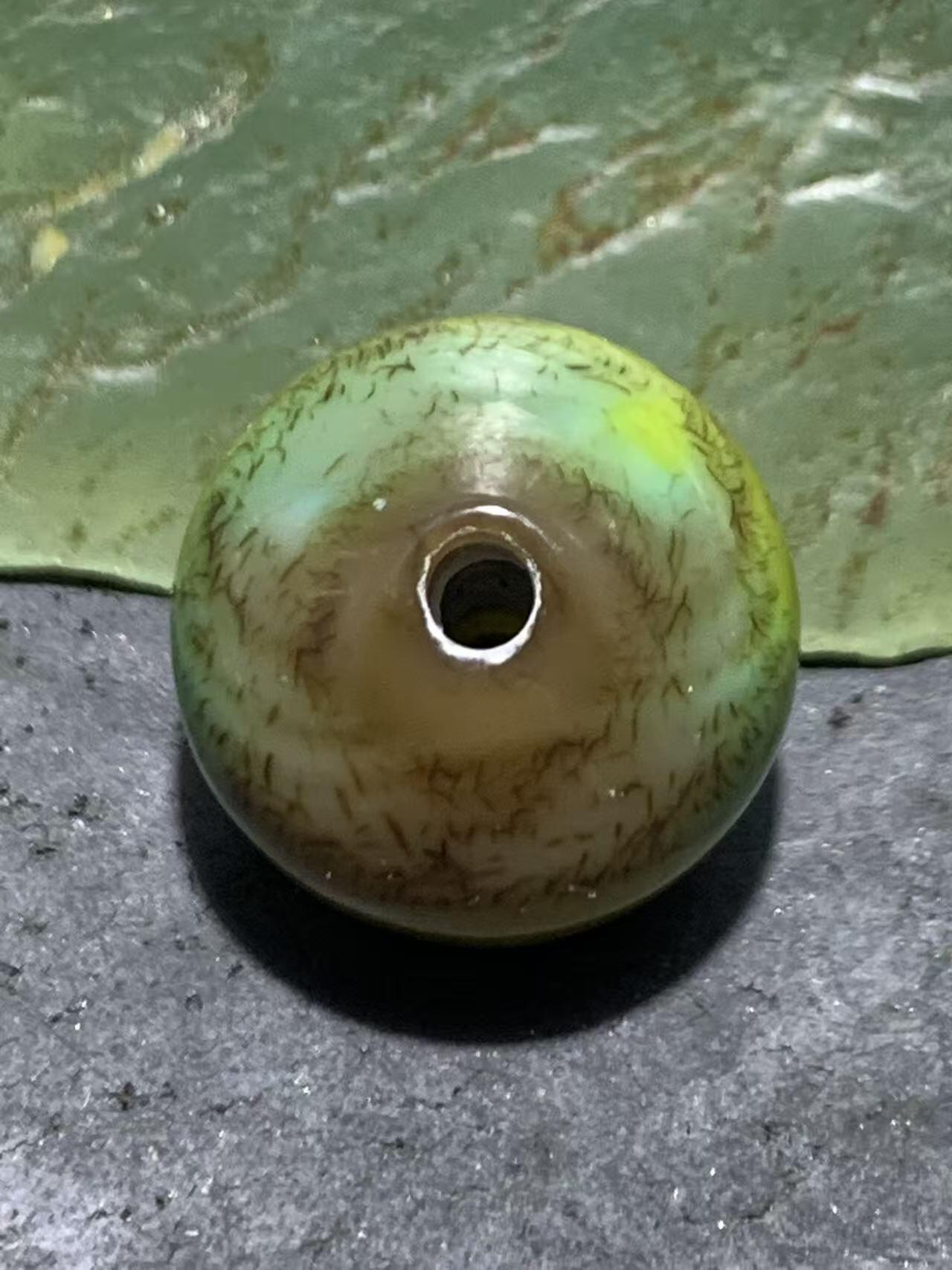 精美高玉化缠丝玛瑙随形碟珠一颗