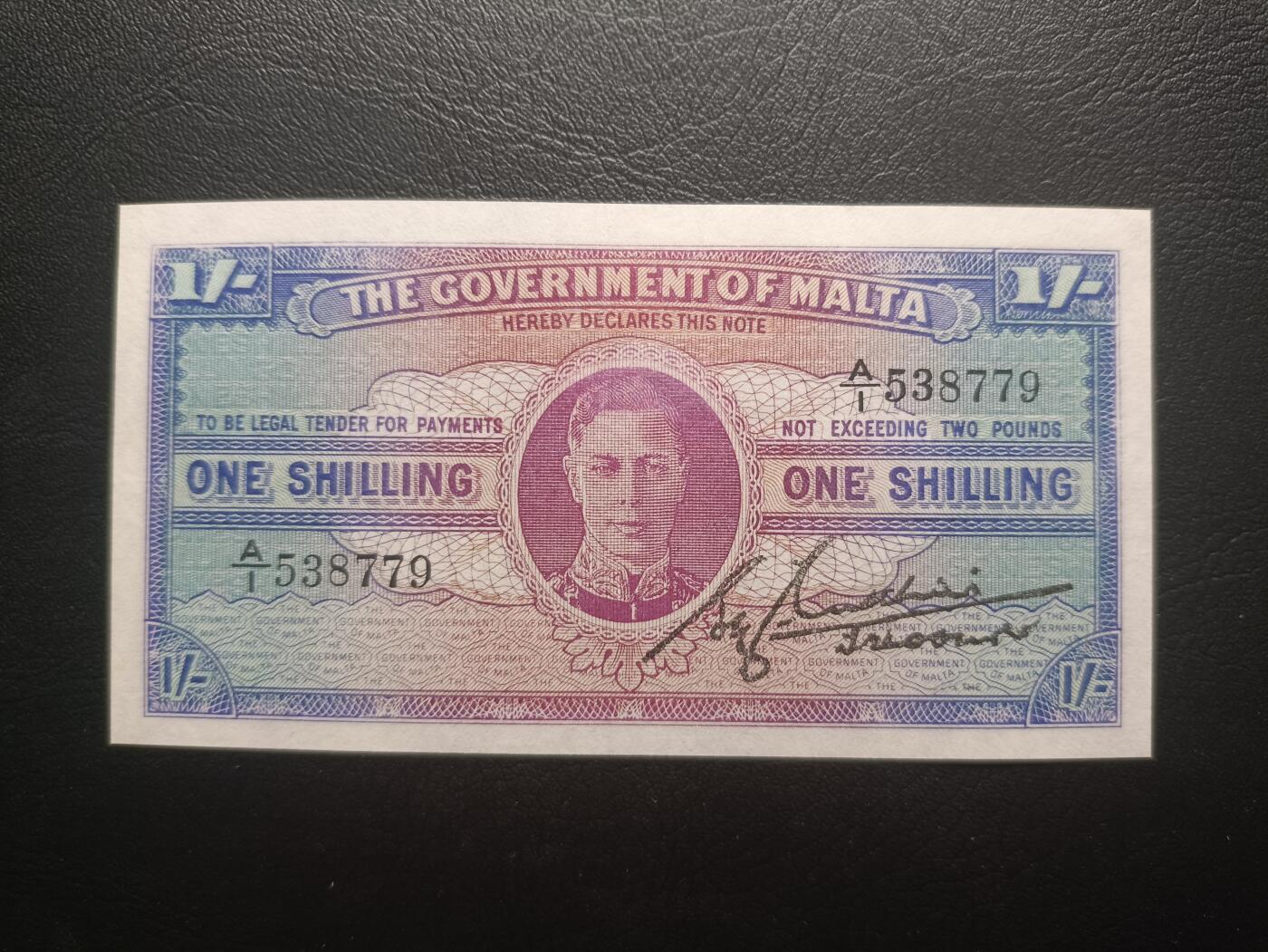2025十一月第一期，总199期 英属马耳他1942版1先令UNC-背面微污首冠A/1，乔治六世国王，少见战时英属殖民地辅币品种