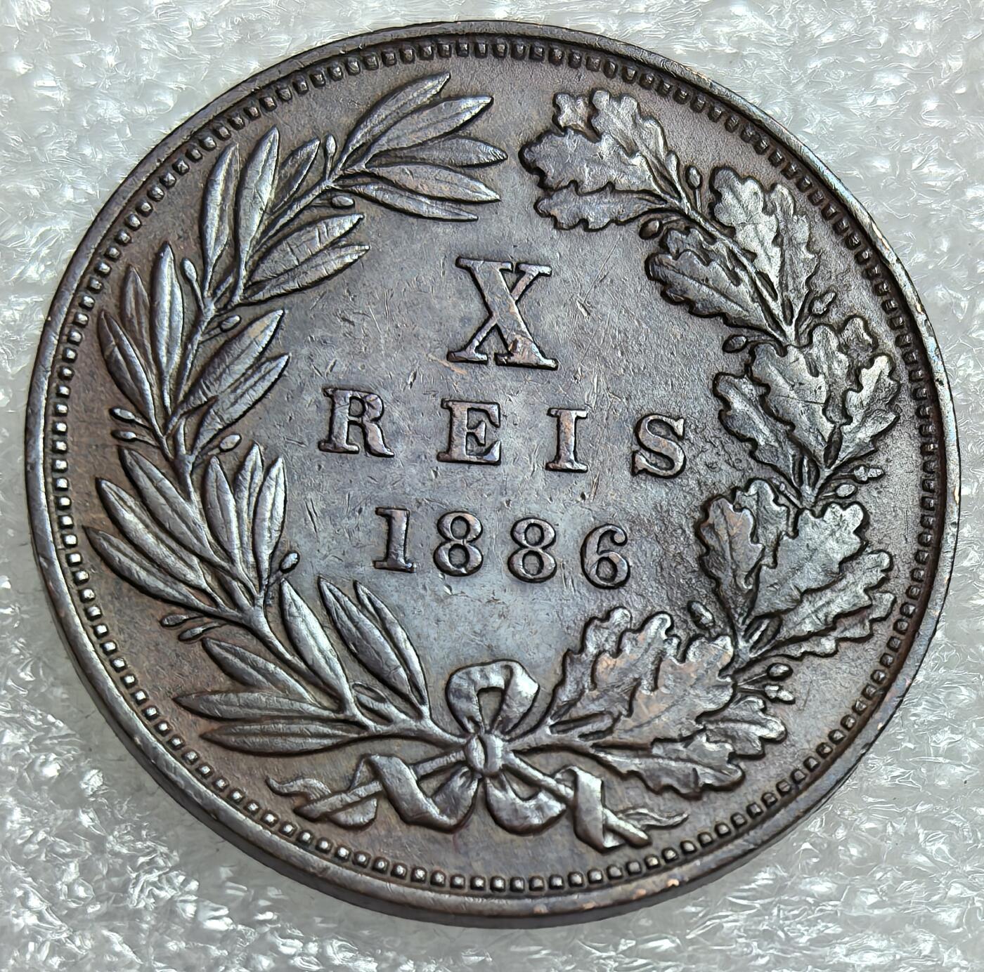 埃及、德属东非、匈牙利、葡萄牙、沙俄古银币古铜币，周五晚上九点倒数截拍，满百包邮，可寄存半年，喜欢朋友微信扫描二维码可直接参拍 好品葡萄牙1886年10瑞斯，km526