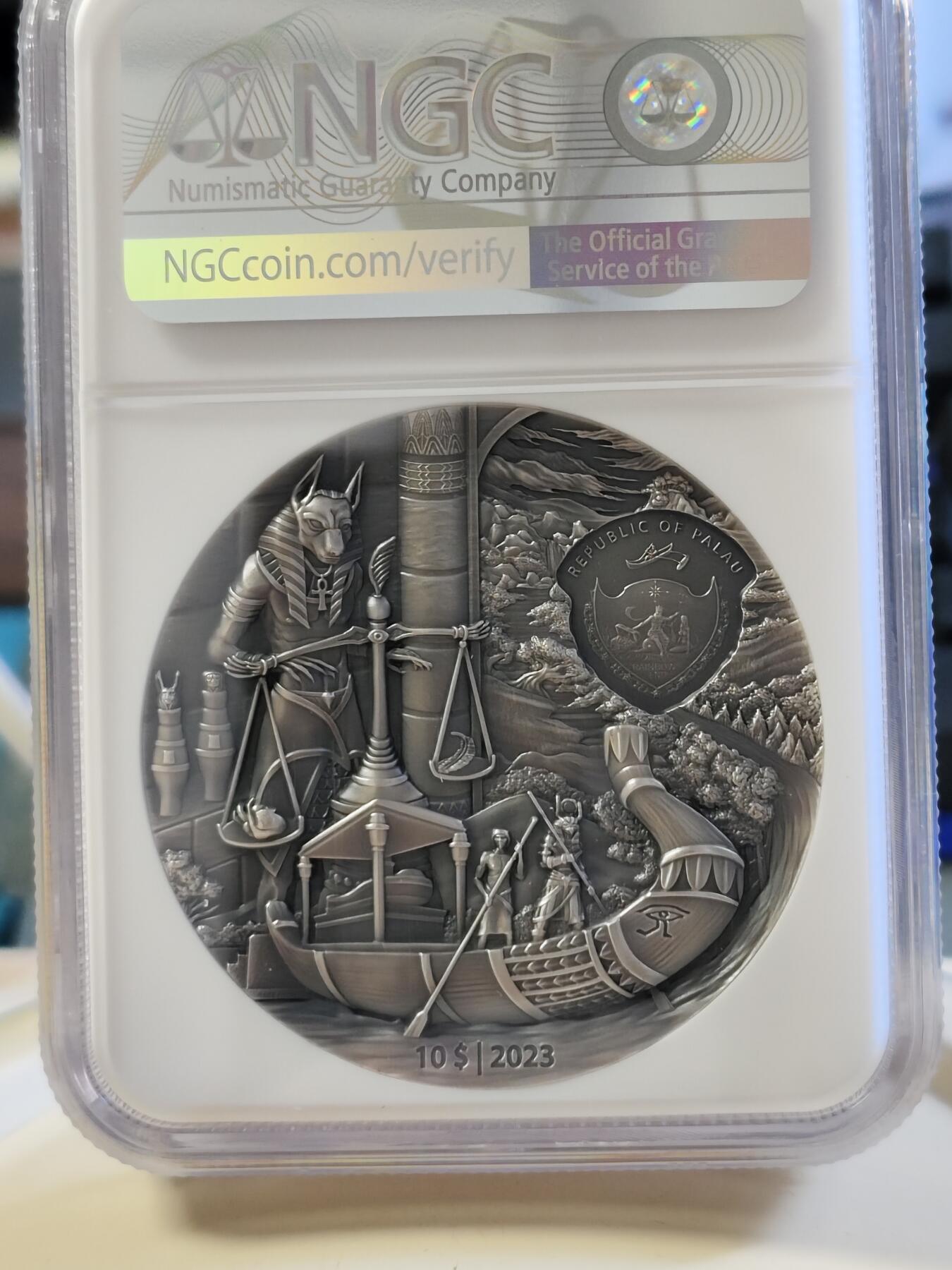 第180期拍卖【长期征集拍品】【北京币展专场】 帕劳2023年葬礼往生系列埃及2盎司仿古彩色纪念银币NGC-MS70首原盒证书，999银，发行555枚