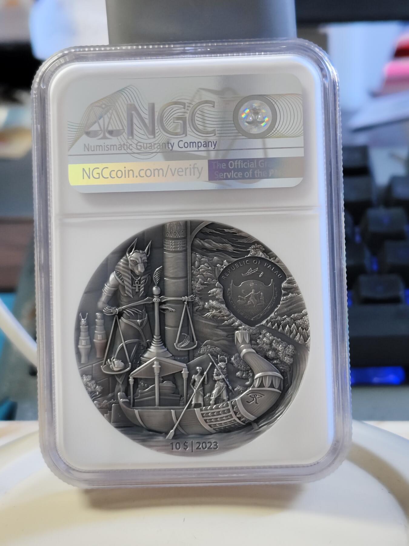 第180期拍卖【长期征集拍品】【北京币展专场】 帕劳2023年葬礼往生系列埃及2盎司仿古彩色纪念银币NGC-MS70首原盒证书，999银，发行555枚