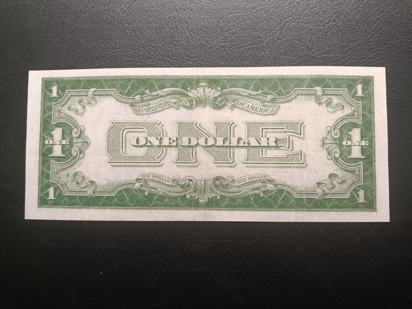 2025十一月第一期，总199期 美国1928B年版银币券1元流通好品XF长号无47，背面因为其扭曲的字体俗称“滑稽1元”