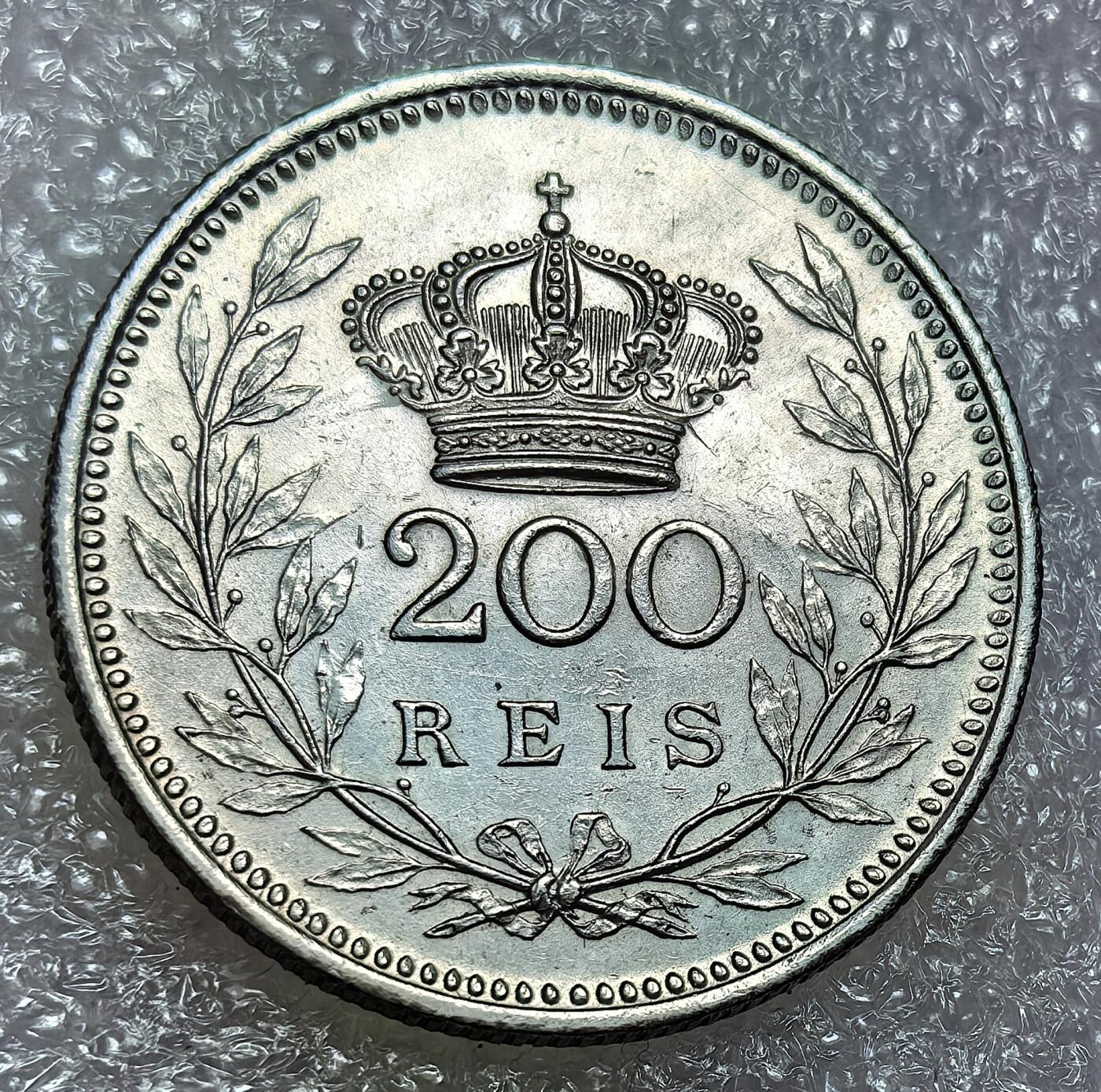 埃及、德属东非、匈牙利、葡萄牙、沙俄古银币古铜币，周五晚上九点倒数截拍，满百包邮，可寄存半年，喜欢朋友微信扫描二维码可直接参拍 全新银币葡萄牙1909年200瑞斯,km549