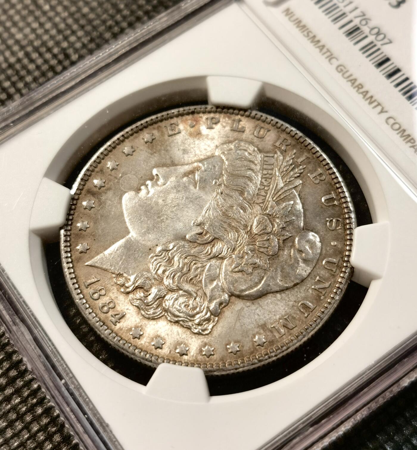 甄臻铺-世界币章拍卖（第37期），送拍享返佣金等优惠多多 NGC-MS63 1884美国摩根一元银币，双面五彩，小版