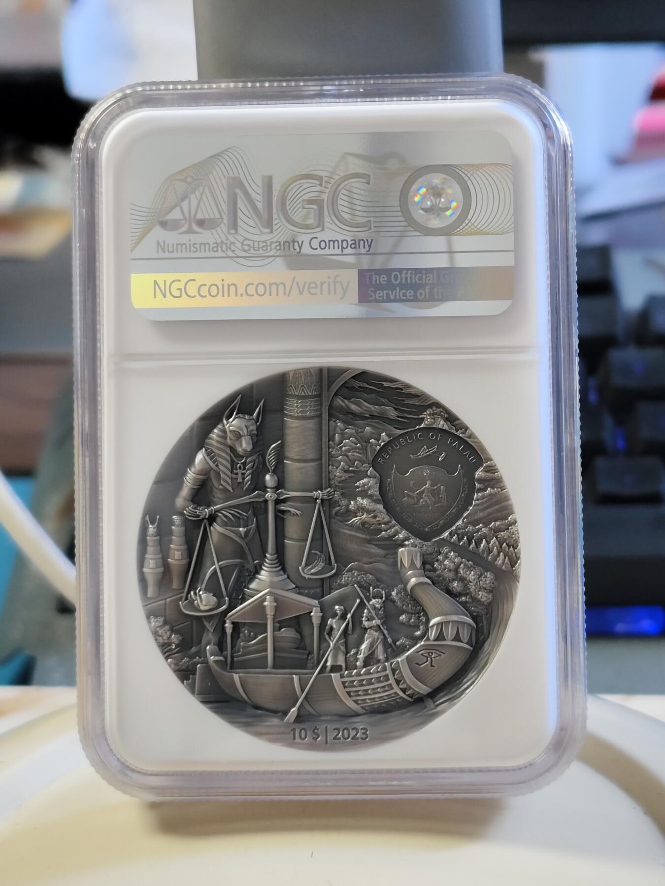 第180期拍卖【长期征集拍品】【北京币展专场】 帕劳2023年葬礼往生系列埃及2盎司仿古彩色纪念银币NGC-MS70首原盒证书，999银，发行555枚