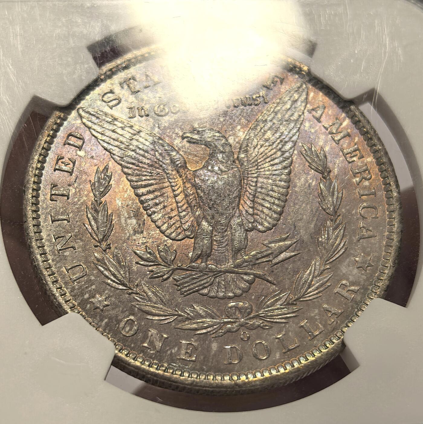 博洋堂世界钱币拍卖第144期（全场包邮） NGC MS65 美国1885年摩根银币O厂 女神面多色系五彩，油画一般 ，背面紫罗兰满彩，非常好看的一枚摩根