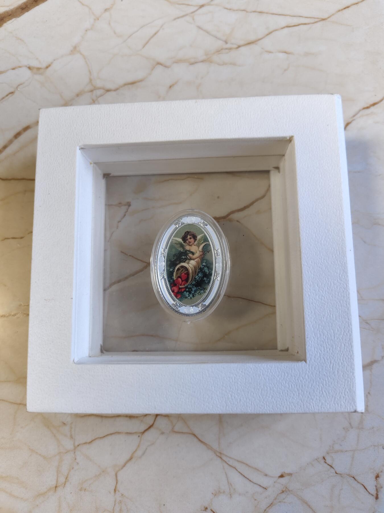 第180期拍卖【长期征集拍品】【北京币展专场】 喀麦隆2020年爱之天使彩印椭圆形精制纪念银币，999银，10克，发行999枚