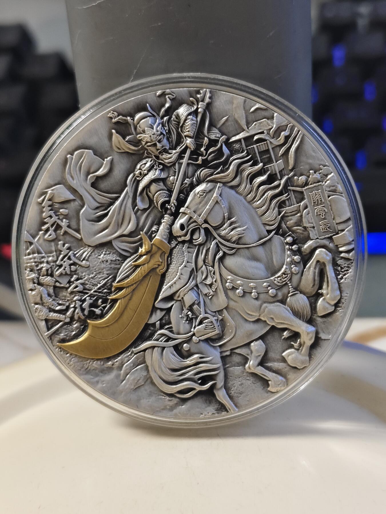 第180期拍卖【长期征集拍品】【北京币展专场】 加纳2019年世界名将系列1关羽高浮雕2盎司镀金银币，999银，发行量500枚