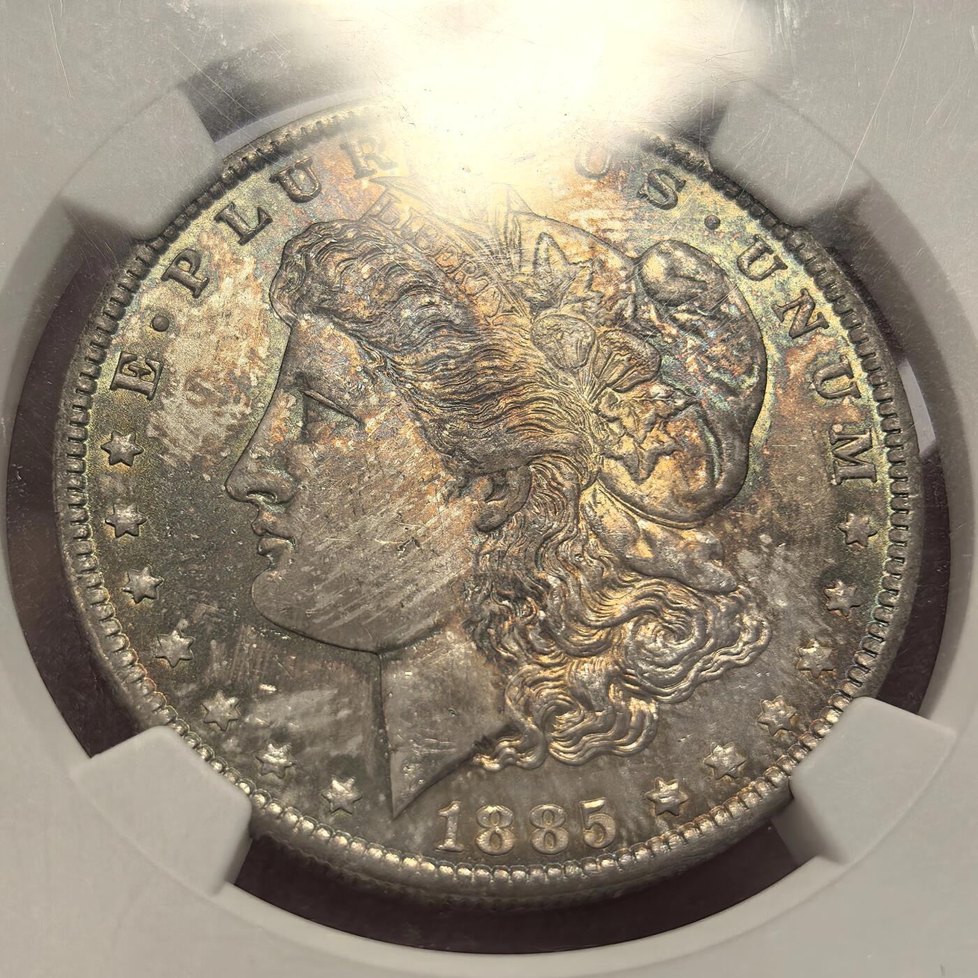 博洋堂世界钱币拍卖第144期（全场包邮） NGC MS65 美国1885年摩根银币O厂 女神面多色系五彩，油画一般 ，背面紫罗兰满彩，非常好看的一枚摩根