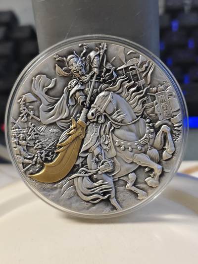 第180期拍卖【长期征集拍品】【北京币展专场】 - 加纳2019年世界名将系列1关羽高浮雕2盎司镀金银币，999银，发行量500枚