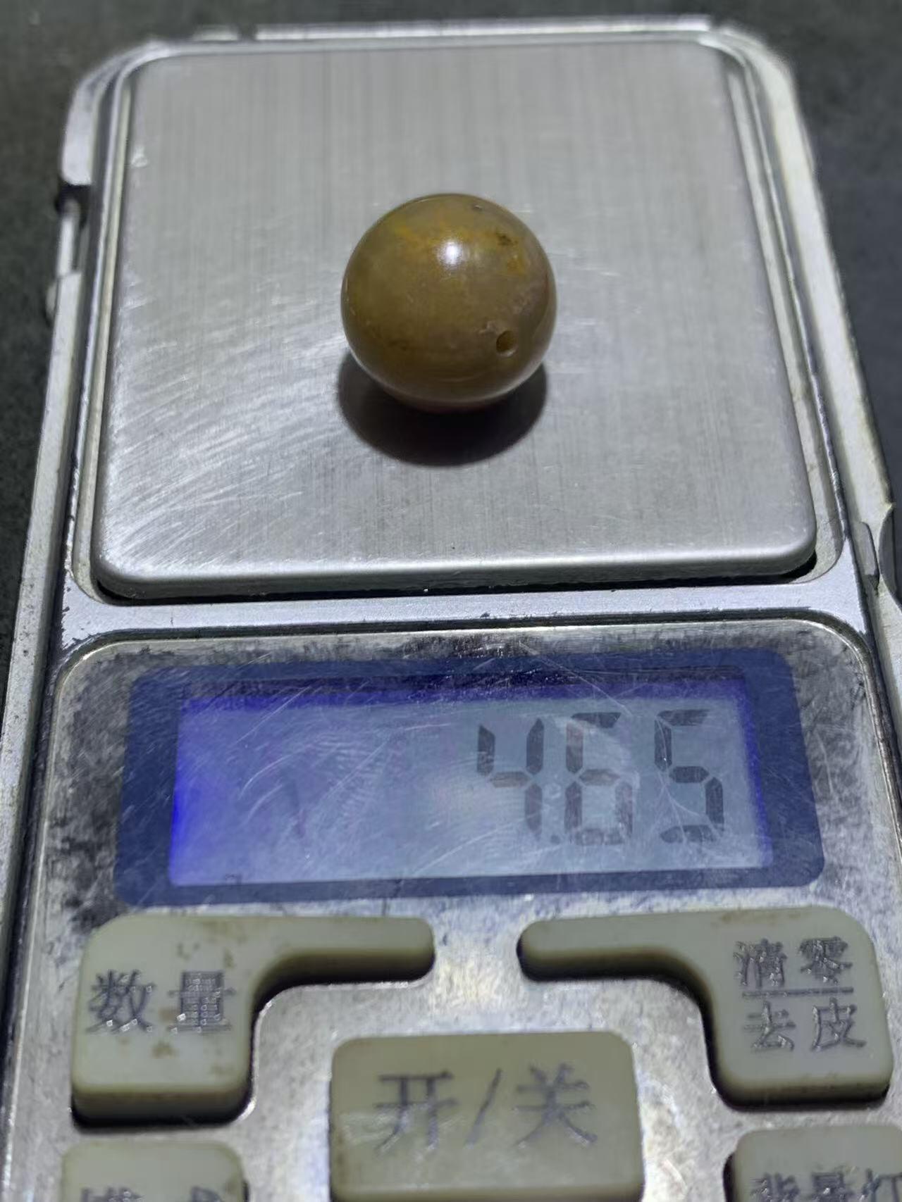 冻料草花纹战国红玛瑙通货随形圆珠一颗，