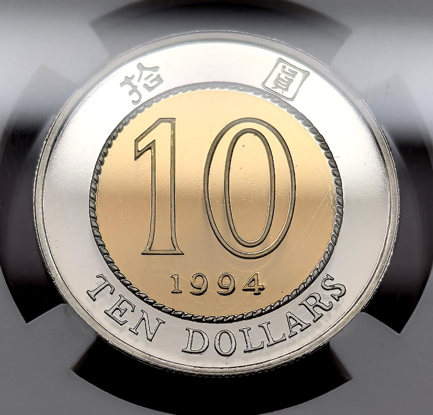 凡希社世界钱币微拍第三百十三期 1994香港紫荆花10元金银双金属币NGC-PF69UC，附原盒证书，很简洁的设计但相当耐看，收藏级品质。
