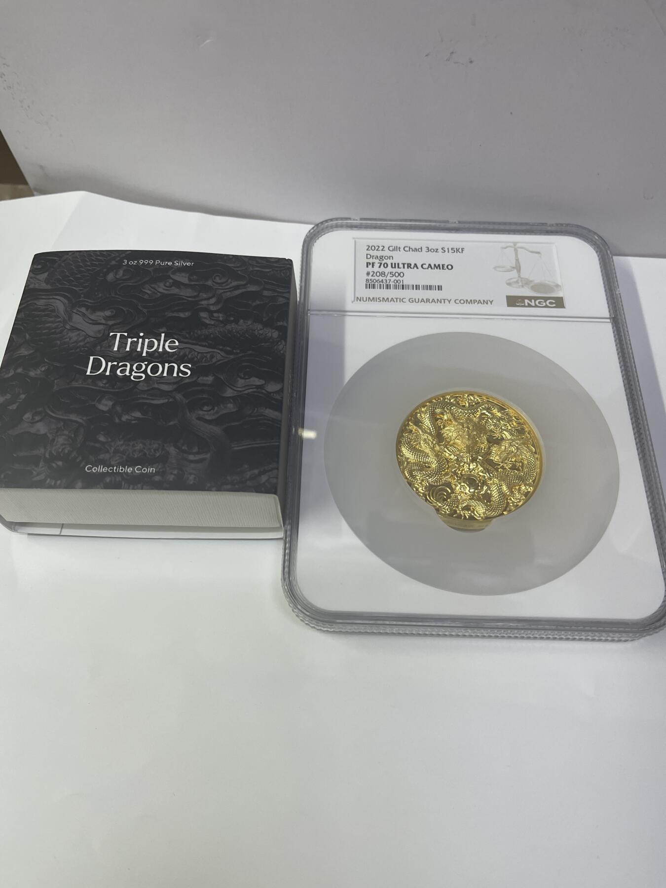 2022年乍得三龙戏珠银币，3盎司999纯银镀金，NGC PF70超cameo评级。编号208/500，品相完美。带原盒原证，收藏佳品