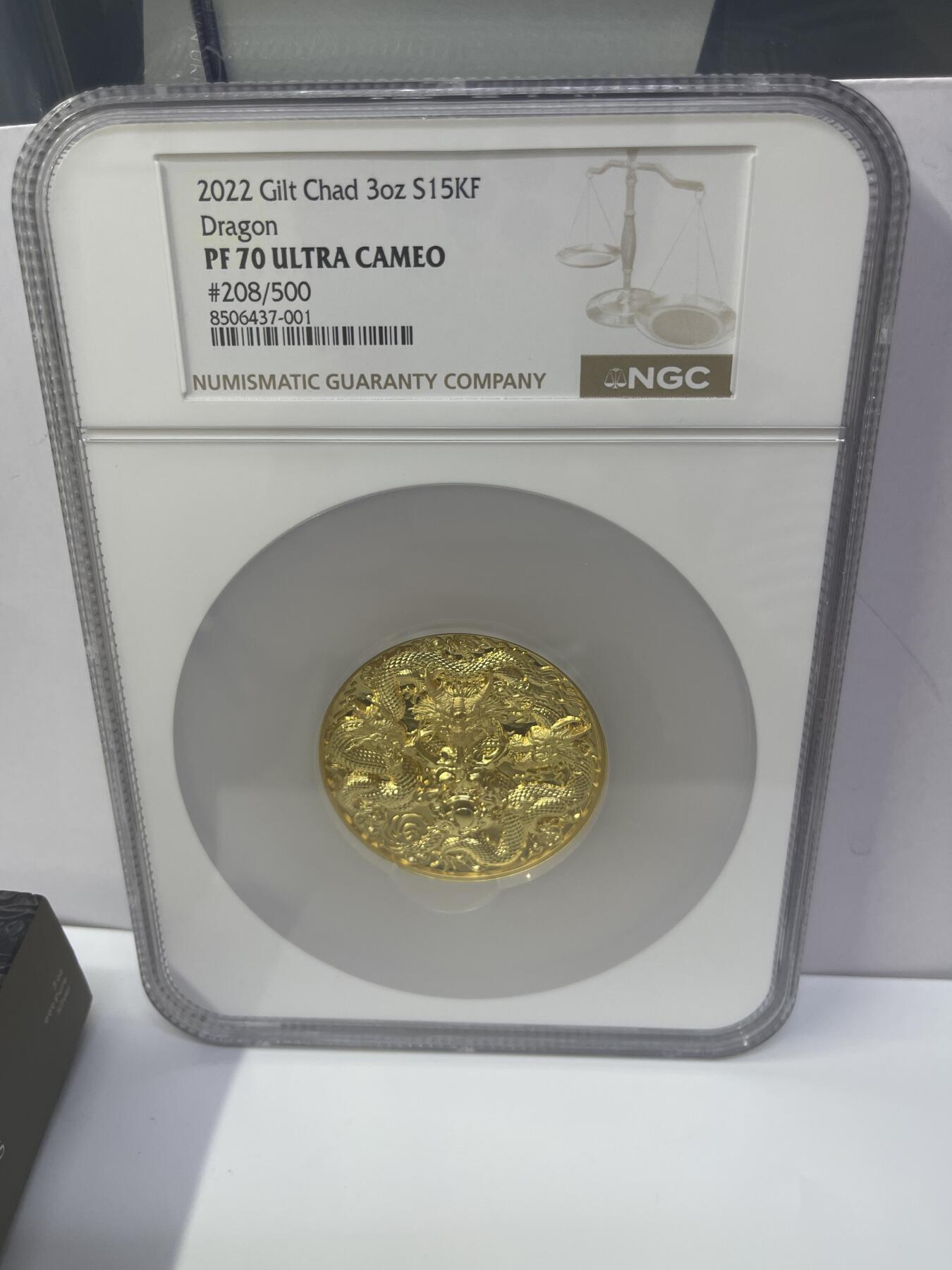 2022年乍得三龙戏珠银币，3盎司999纯银镀金，NGC PF70超cameo评级。编号208/500，品相完美。带原盒原证，收藏佳品