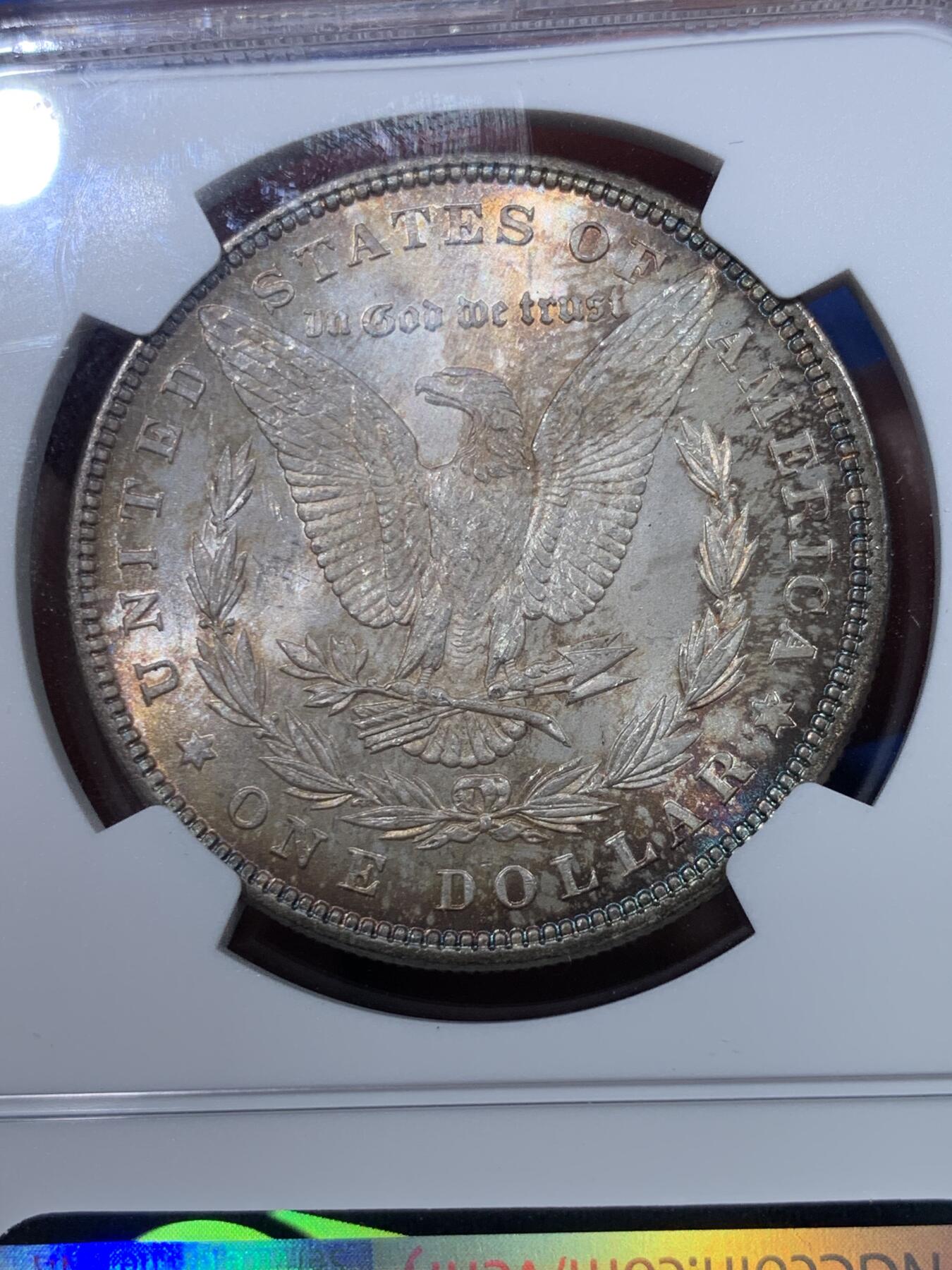 《竞宝斋》第434场 周日，周一2场连拍 （全场包邮） NGC MS64 美国1885年摩根银币 凝霜底板，女神面部神态难得，转光效果，底板底光充沛，双面包浆更美。