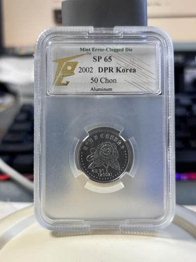 第180期拍卖【长期征集拍品】【北京币展专场】 - 朝鲜2002年花卉纪念币TQG评级币SP65一枚