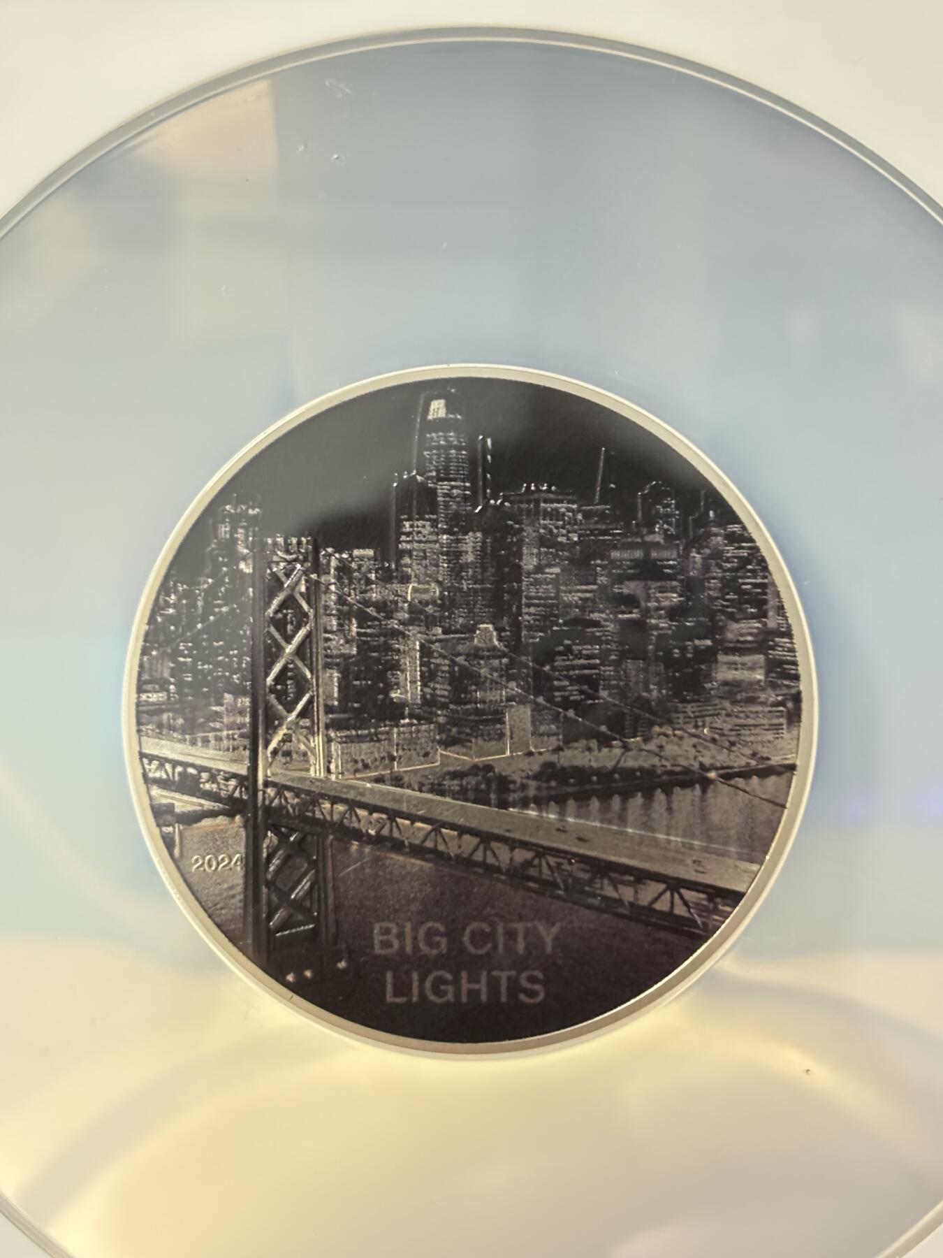 第181期拍卖  库克2024年发行的城之光系列-旧金山光线反射纪念银币NGC-PF70首 无盒无证书，999银，1盎司