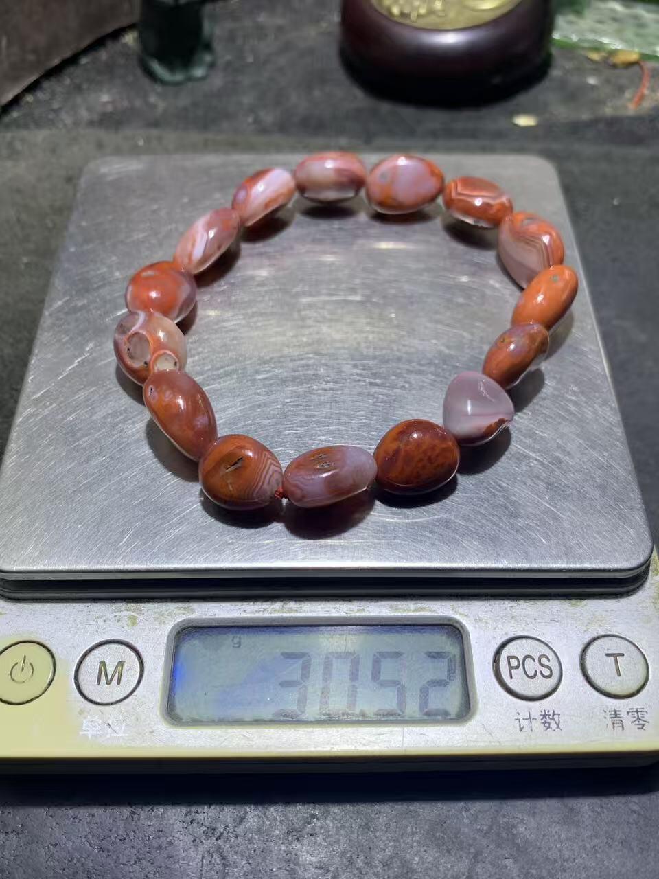 川料原皮红白冰飘南红玛瑙随形单圈手串一条，