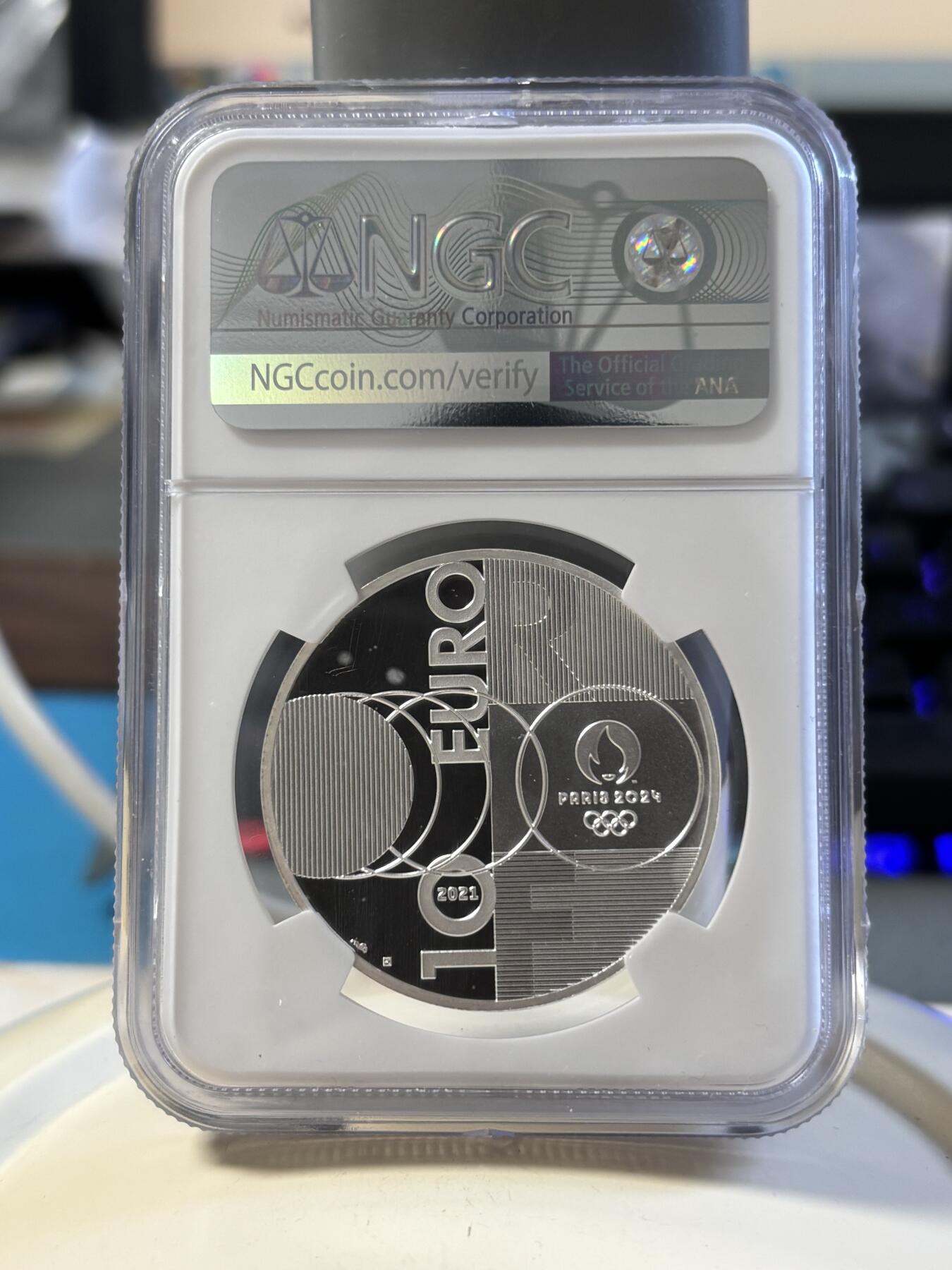 第181期拍卖 法国2021年东京到巴黎奥运交接纪念银币NGC-PF70首无盒无证书，999银，22.2克，发行30000枚，有氧化点