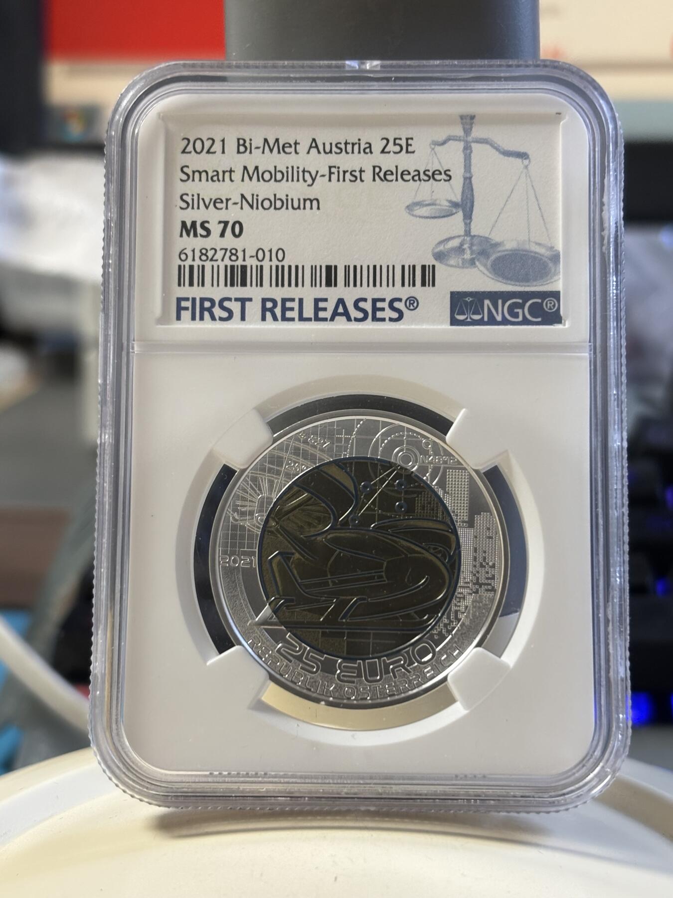 第181期拍卖 获奖奥地利2021年银铌双金属系列智能交通25欧银币NGC-MS70首无盒证书，2023年度克劳斯最佳双金属币面值:25欧元，金属:900银/998铌，重量:9/6.5克，直径:35毫米，发行：65000枚