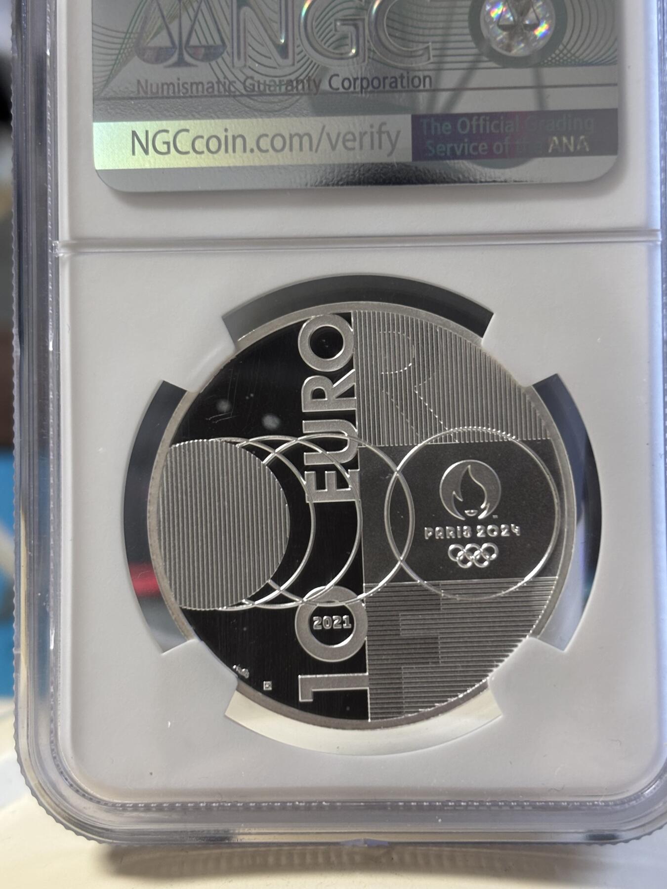 第181期拍卖 法国2021年东京到巴黎奥运交接纪念银币NGC-PF70首无盒无证书，999银，22.2克，发行30000枚，有氧化点