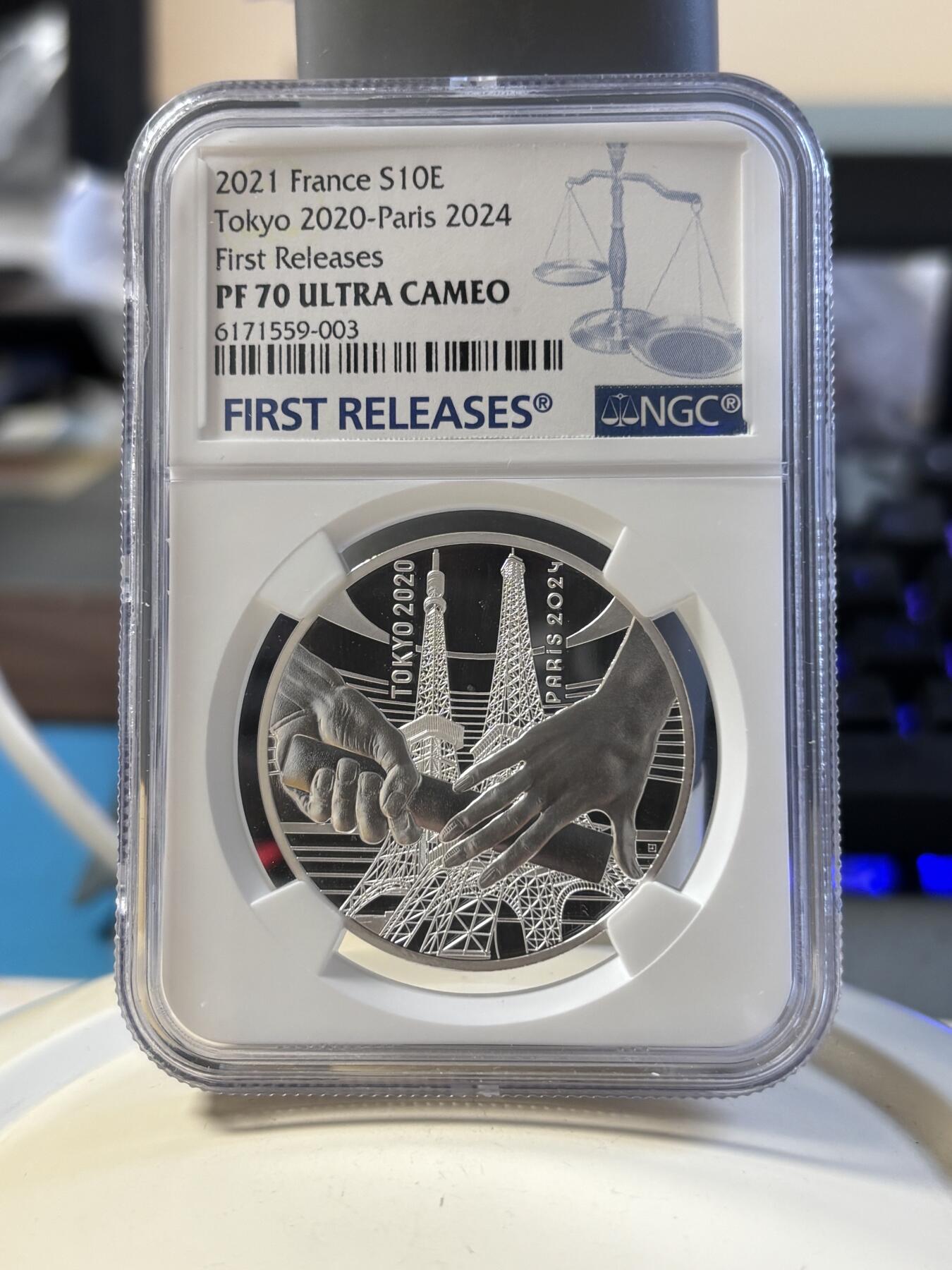 第181期拍卖 法国2021年东京到巴黎奥运交接纪念银币NGC-PF70首无盒无证书，999银，22.2克，发行30000枚，有氧化点
