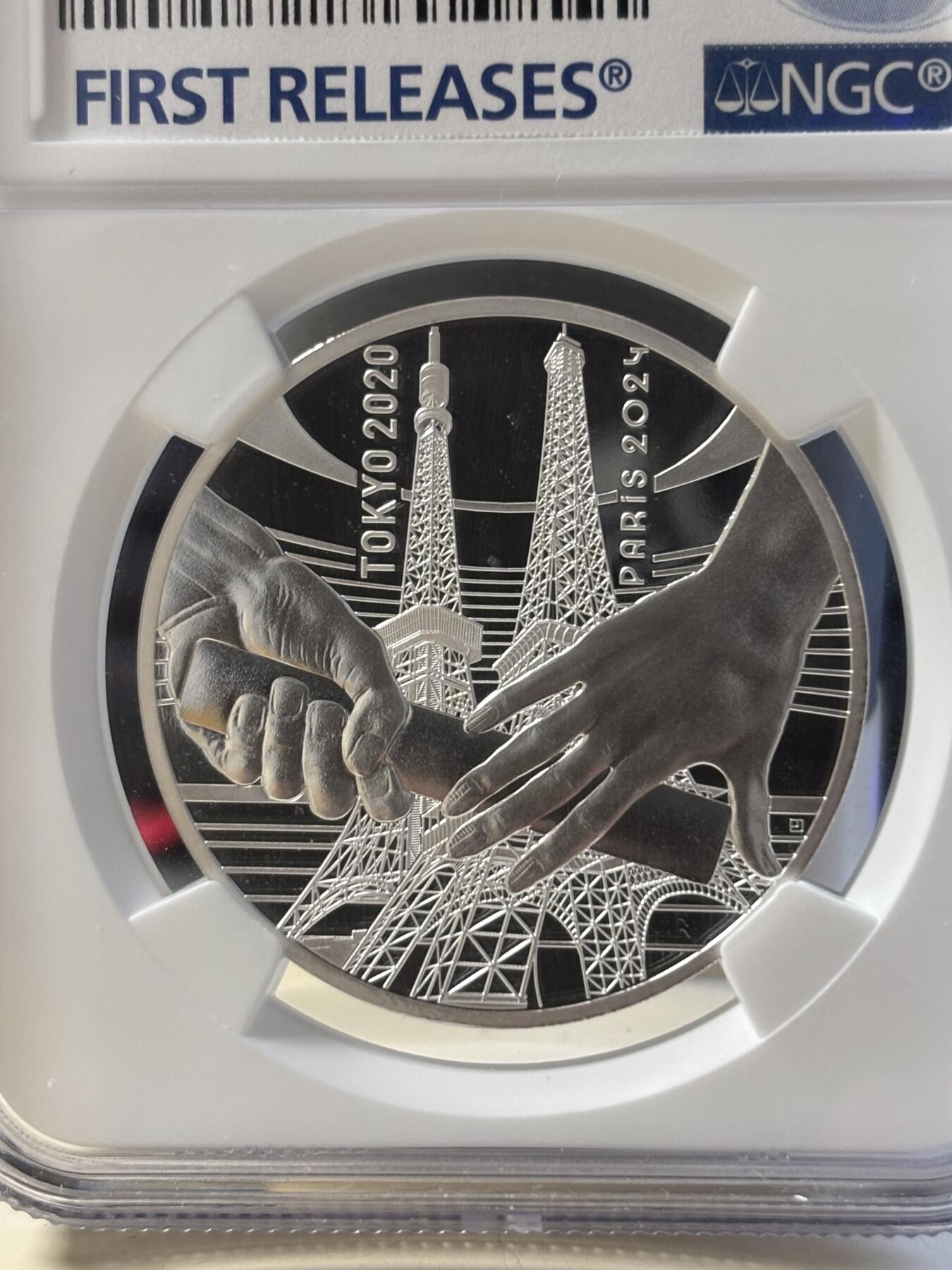 第181期拍卖 法国2021年东京到巴黎奥运交接纪念银币NGC-PF70首无盒无证书，999银，22.2克，发行30000枚，有氧化点