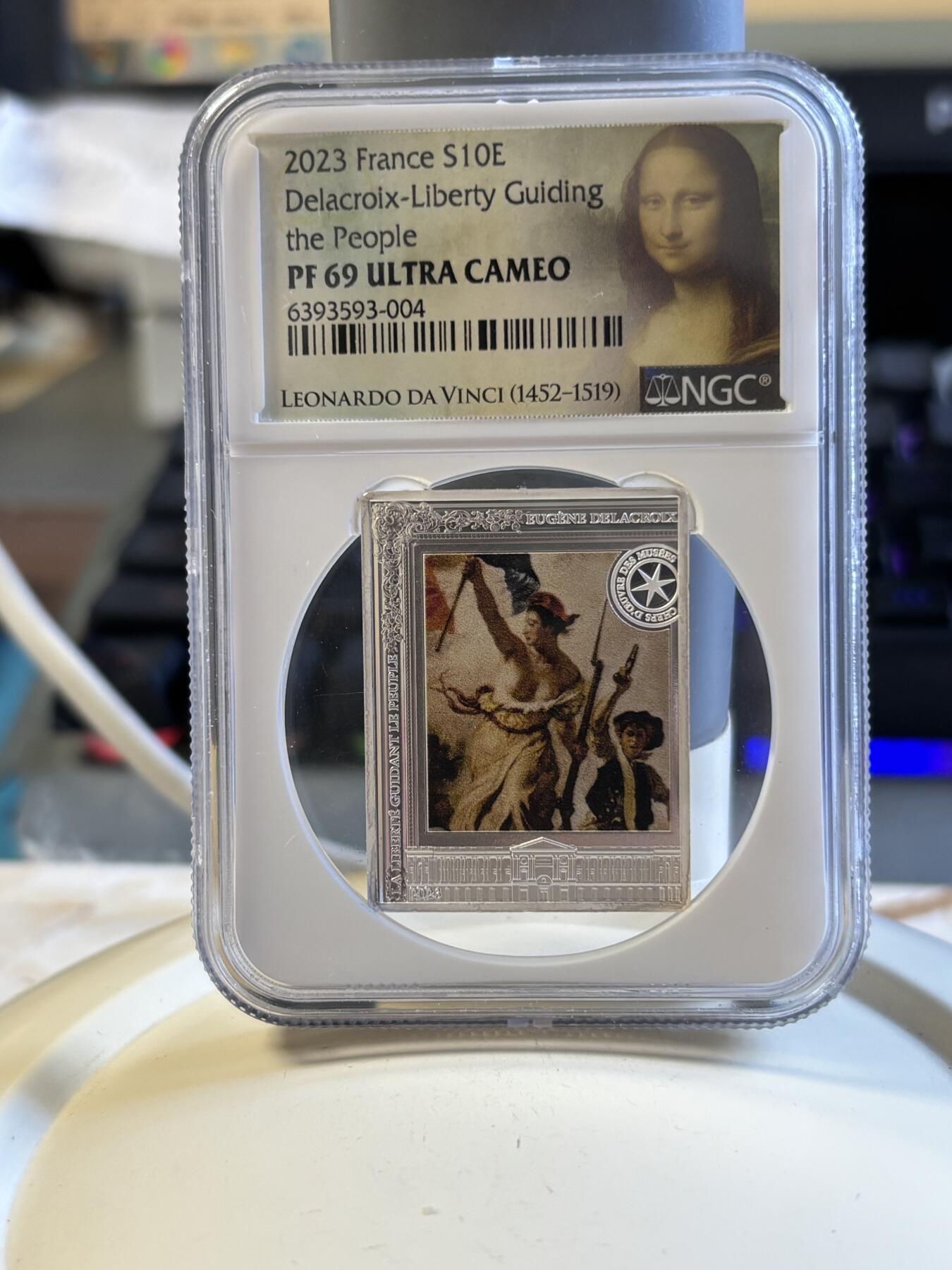 第181期拍卖  2023年法国10欧精制纪念彩色银币 自由指引人民NGC PF69 特殊蒙娜丽莎标，999银，22.2克