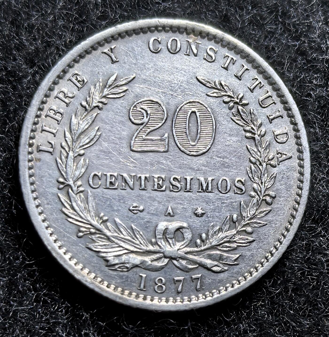 西班牙、丹属西印度、法属殖民地、乌拉圭银币古铜币，周五晚上九点倒数截拍，满百包邮，可寄存半年，喜欢朋友微信扫描二维码可直接参拍 AU品相乌拉圭1877年20分银币，km15